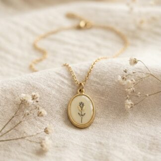 Collier médaillon beige et fleur dorée