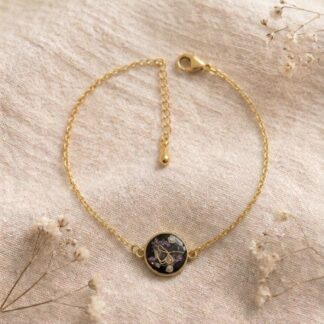 Bracelet noir fleur dorée et petites fleurs séchées